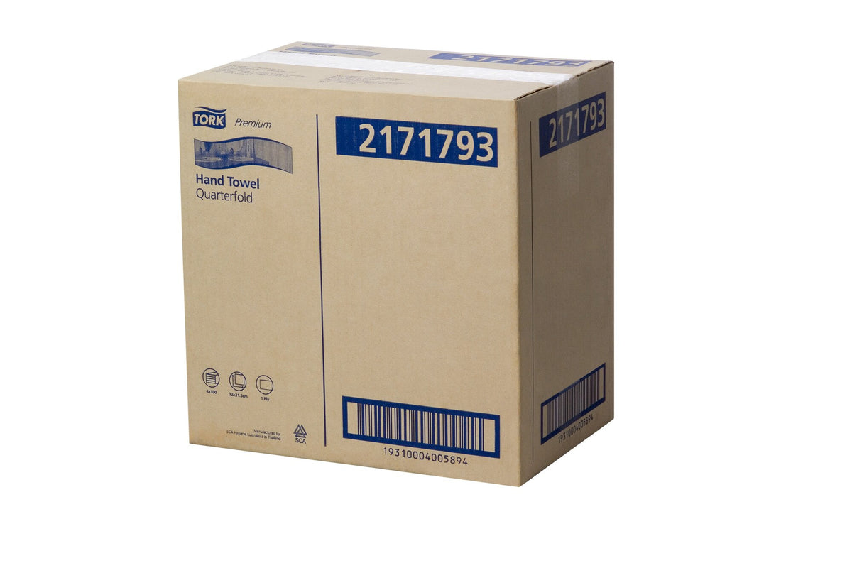 Photographed shipper carton of Tork Extra Soft Guest Hand Towel 2171793, printed Tork Premium Hand Towel Quarterfold with an icon row reading 4x100, 32x31.5cm and 1 Ply