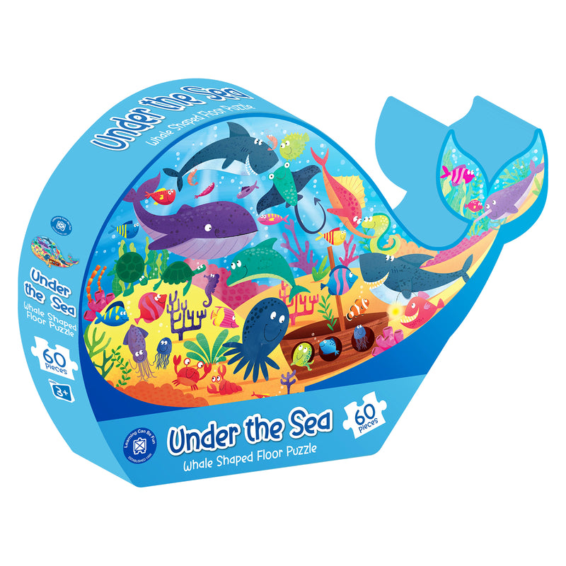 Retail packaging for the Under the Sea Whale Shaped Floor Puzzle featuring the completed whale design on bright blue packaging. The box highlights the 60 piece count, ocean adventure theme and suitability for children aged three years and above.