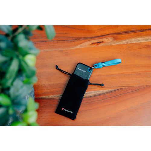 Verbatim Pocket SSD with blue cable resting on a black drawstring pouch on a timber table