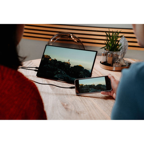 Verbatim 14 inch monitor displaying a presentation slide in a meeting setting