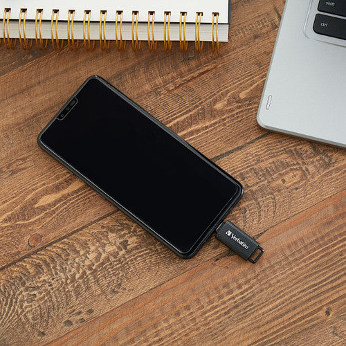 Verbatim 128GB portable flash drive beside a USB-C laptop port