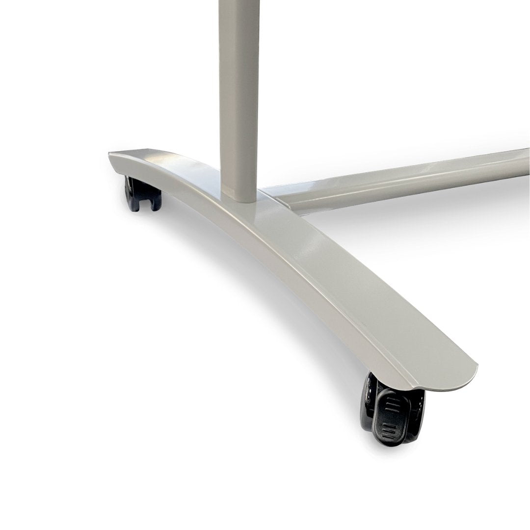 Close up of one curved silver base leg of the Chilli frame with its black twin wheel castor, photographed against a white background.