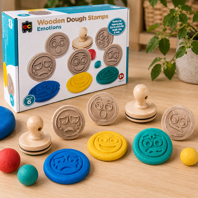 Wooden Dough Stamps Emotions boxed set displayed with stamped dough emotion faces and sensory play materials suitable for classrooms and early childhood learning environments.