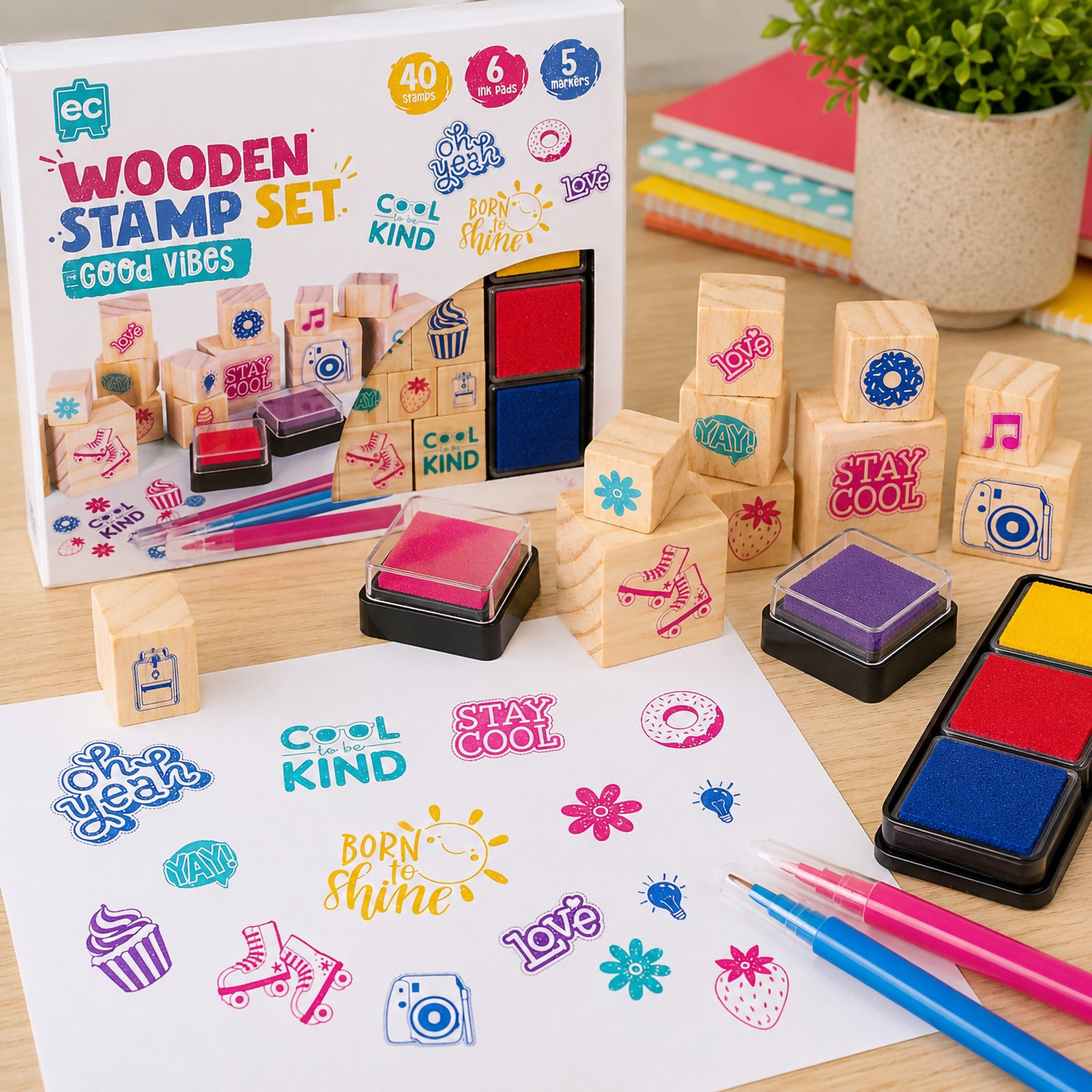 Educational Colours Good Vibes Wooden Stamp Set displayed with colourful stamped artwork, reusable ink pads, and positivity themed wooden blocks in a cheerful classroom inspired setting.