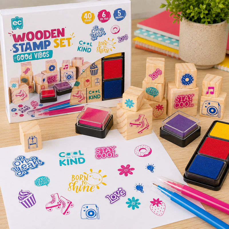 Educational Colours Good Vibes Wooden Stamp Set displayed with colourful stamped artwork, reusable ink pads, and positivity themed wooden blocks in a cheerful classroom inspired setting.