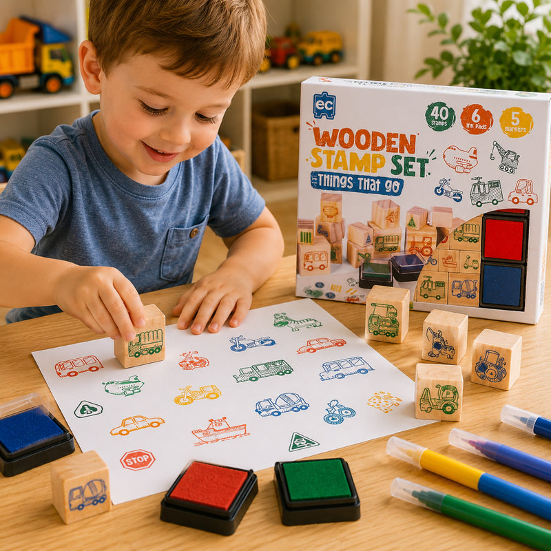 Young child using the Educational Colours Wooden Stamp Set Things That Go with colourful vehicle stamps, ink pads, and markers to create transport themed artwork featuring buses, trucks, scooters, and construction vehicles.