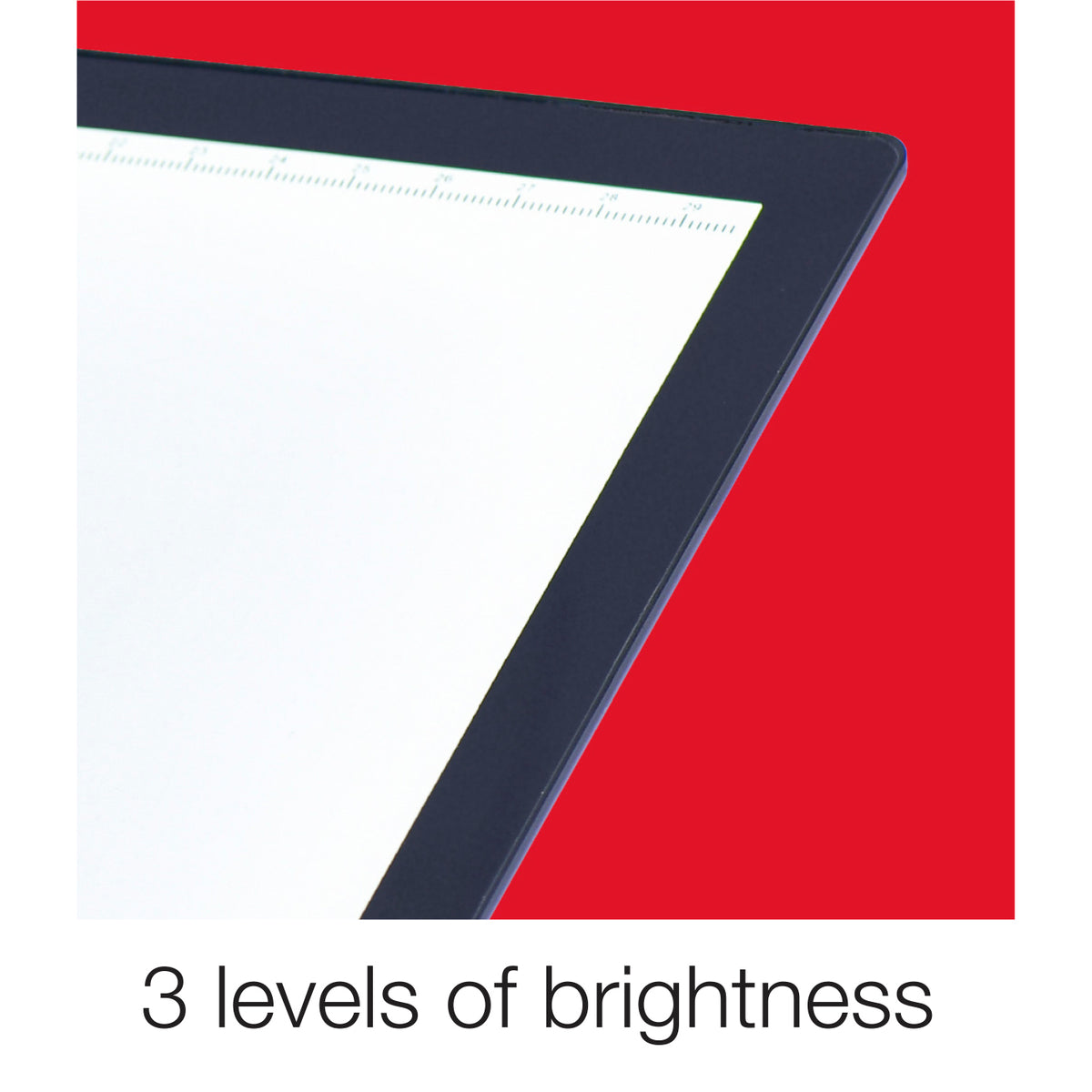 X-Press It LED Light Pad A3 corner close-up of the lit white surface and dark frame with printed ruler scale, captioned 3 levels of brightness