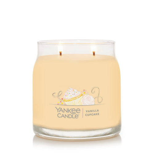 Close-up of the Vanilla Cupcake candle label showing hand-illustrated artwork and fragrance notes