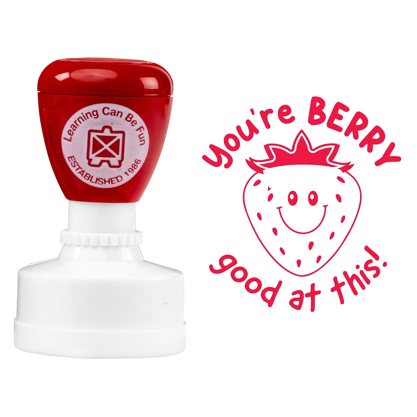 Product close up featuring the self inking merit stamp alongside the detailed strawberry character artwork and positive message. The design is clearly visible, making it ideal for rewarding learning progress and classroom success.