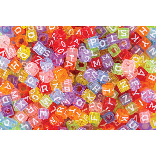 Close-up of Zart alphabet cube beads with bold white capital letters