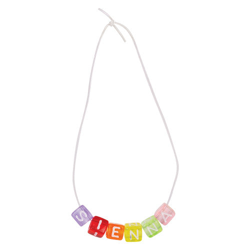 Child threading Zart alphabet cube beads for a craft activity