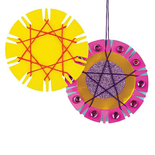 Assorted yellow, blue, green, pink, orange and turquoise Zart maths baubles laid flat