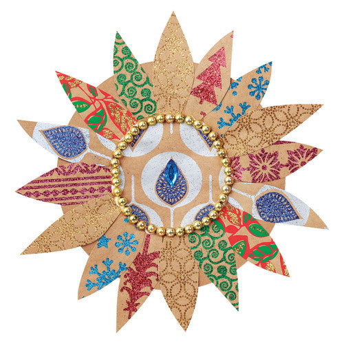 Close-up of glitter-infused Christmas design on natural brown kraft paper