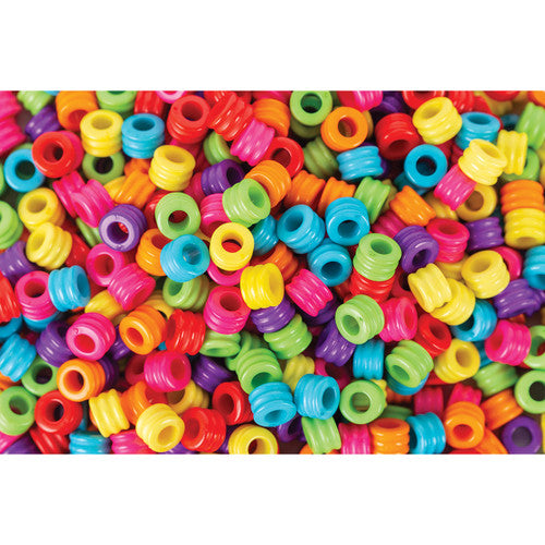 Close-up of Zart 5x7mm cylinder beads showing ribbed texture and 3mm hole