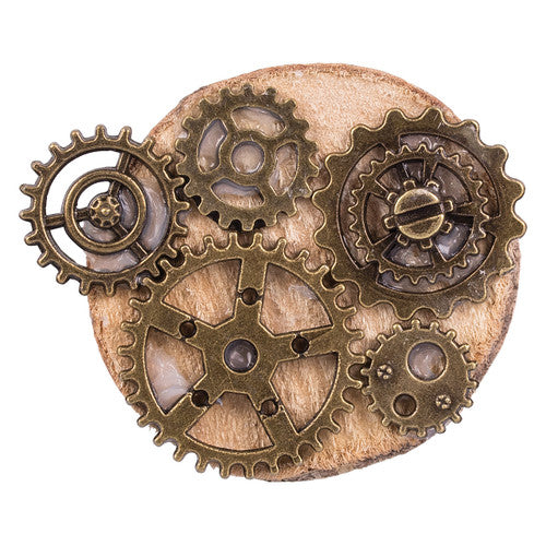 Close-up of bronze-aged metal cogs ranging from 12mm to 41mm