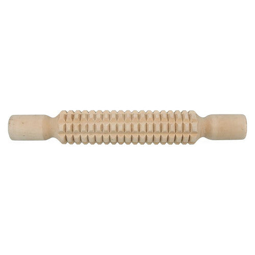 Zart patterned rolling pins next to clay dough on a craft table