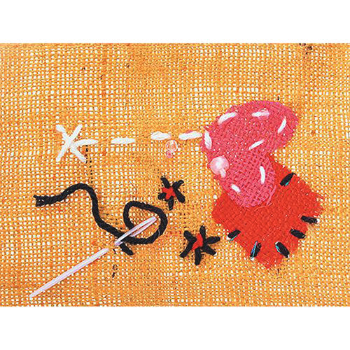 Zart pack of 12 plastic darning needles laid out on a flat surface
