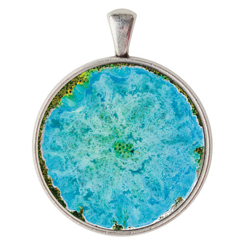 Round silver cabochon setting shown with a custom photo insert