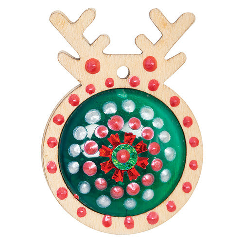 Zart reindeer pendants arranged in a row on a craft table