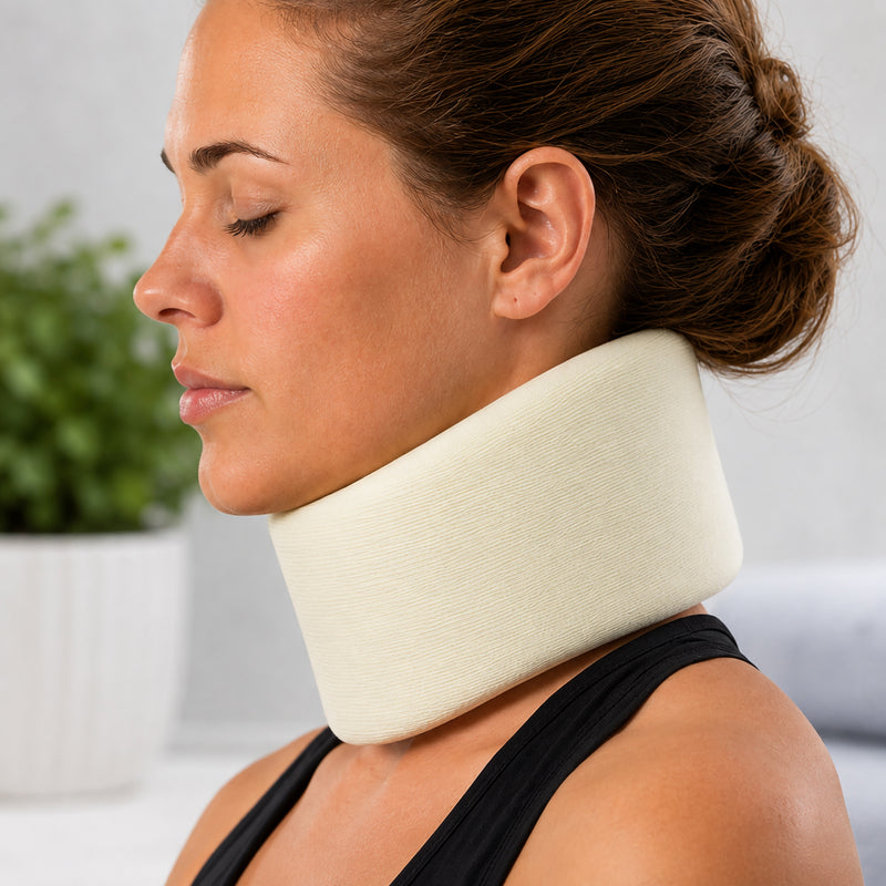 Side profile lifestyle view of a person wearing the AeroSupplies Large Foam Cervical Collar. The cream coloured contoured foam sits beneath the chin and surrounds the neck, showing the supportive height and cushioned construction designed to provide gentle stabilisation during appropriate recovery and care.