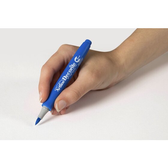 Hand writing with an Artline Decorite Brush Blue marker