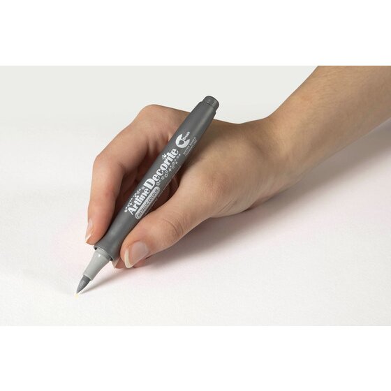 Hand writing with an Artline Decorite Brush Metallic Silver marker