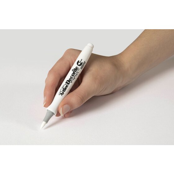 Hand writing with an Artline Decorite Brush White marker