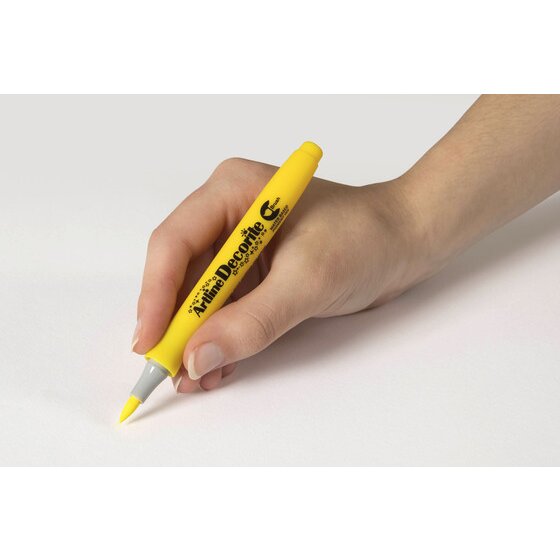 Hand writing with an Artline Decorite Brush Yellow marker