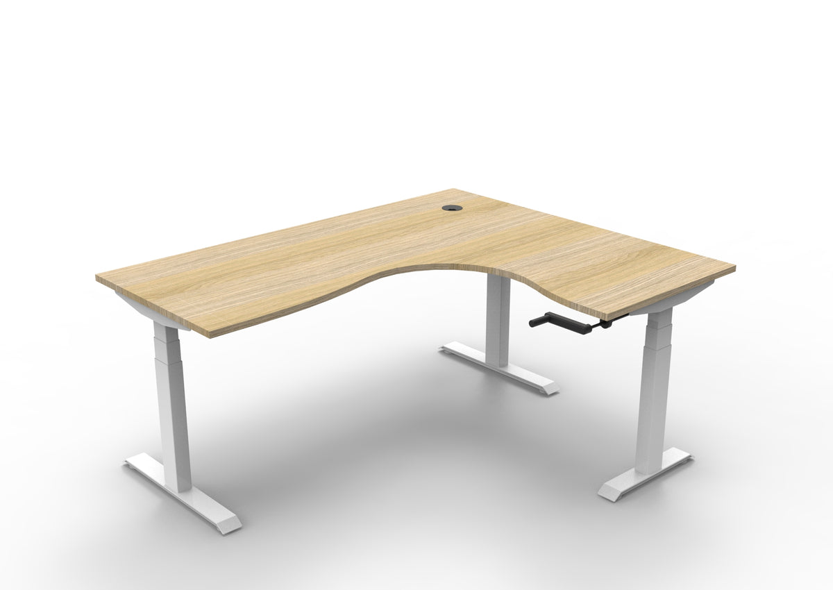 Rapidline Boost Crank manual height adjustable corner workstation, E0 rated Natural Oak top on a white satin powdercoated frame. Supplied product image for model BCCNR1P1815 NO/WS. View 1.
