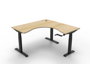 Rapidline Boost Crank manual height adjustable corner workstation, E0 rated Natural Oak top on a black satin powdercoated frame. Supplied product image for model BCCNR1P1515 NO/BL. View 1.