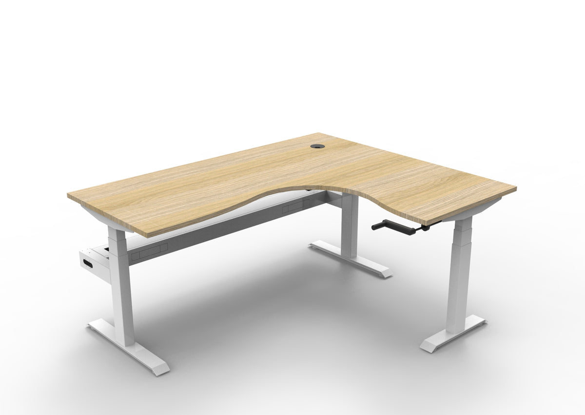 Rapidline Boost Crank manual height adjustable corner workstation, E0 rated Natural Oak top on a white satin powdercoated frame. Supplied product image for model BCCNRCT1P1815 NO/WS. View 1.