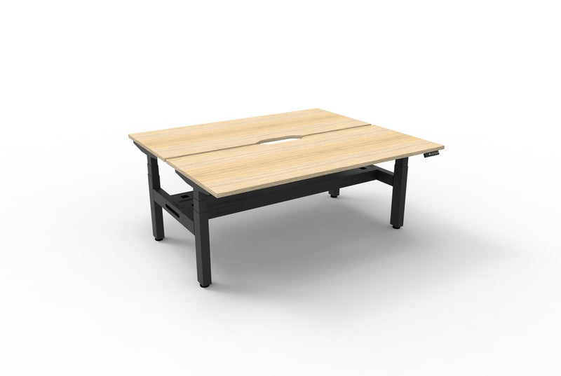 Rapidline Boost Plus electric height adjustable back to back workstation, E0 rated Natural Oak top on a black satin powdercoated frame. Rapidline range image supplied for model B+2PCT1575 NO/BL.