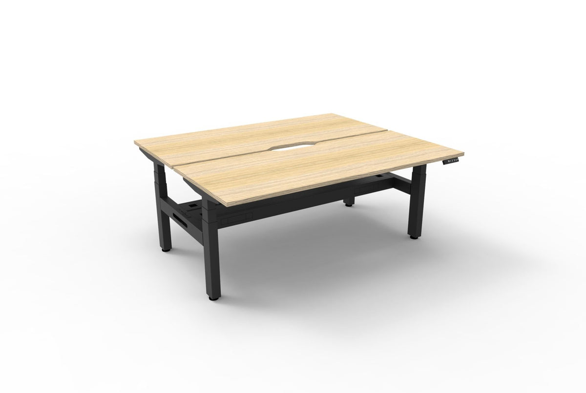 Rapidline Boost Plus electric height adjustable back to back workstation, E0 rated Natural Oak top on a black satin powdercoated frame. Rapidline range image supplied for model B+2PCT1875 NO/BL.