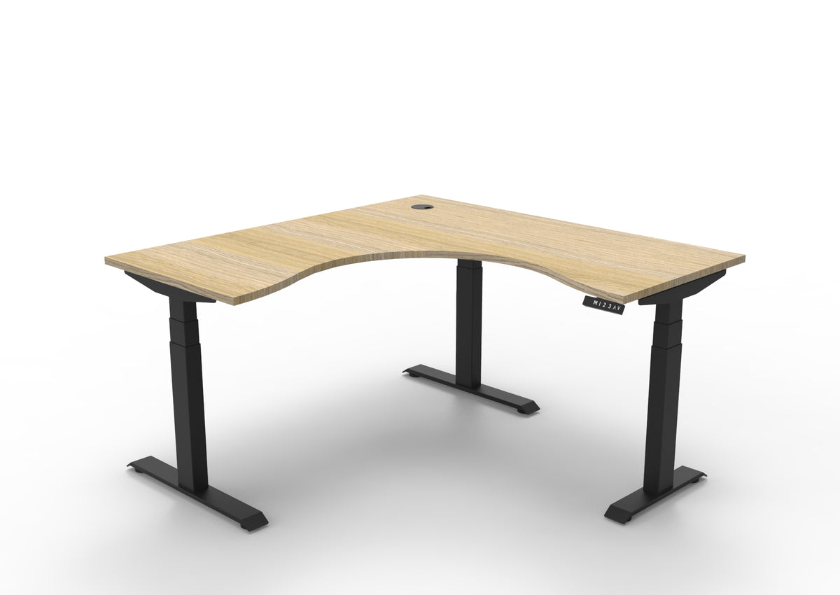 Rapidline Boost Plus electric height adjustable corner workstation, E0 rated Natural Oak top on a black satin powdercoated frame. Supplied product image for model B+CNR1P1515 NO/BL. View 1.