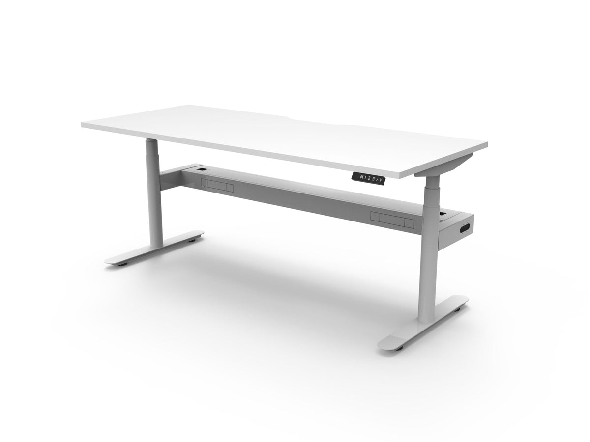 Rapidline Halo Plus electric height adjustable single sided workstation on 70mm diameter round columns, E0 rated Natural White top with a white satin powdercoated frame, fitted ducted cable tray. Rapidline range image supplied for model H+1PCT1275 NW/WS.
