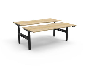 Rapidline Halo Plus electric height adjustable back to back workstation on 70mm diameter round columns, E0 rated Natural Oak top with a black satin powdercoated frame. Rapidline range image supplied for model H+2P1275 NO/BL.