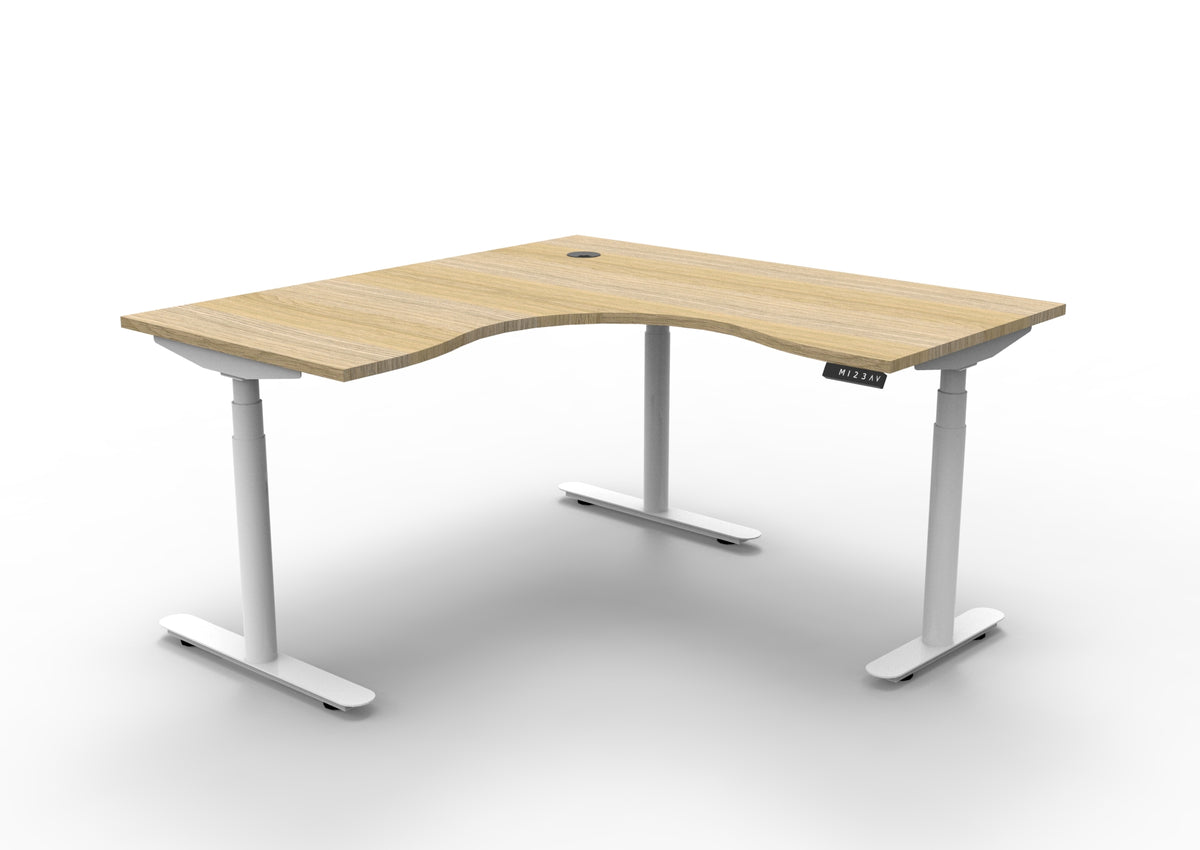 Rapidline Halo Plus electric height adjustable corner workstation on 70mm diameter round columns, E0 rated Natural Oak top with a white satin powdercoated frame. Supplied product image for model H+CNR1P1515 NO/WS.