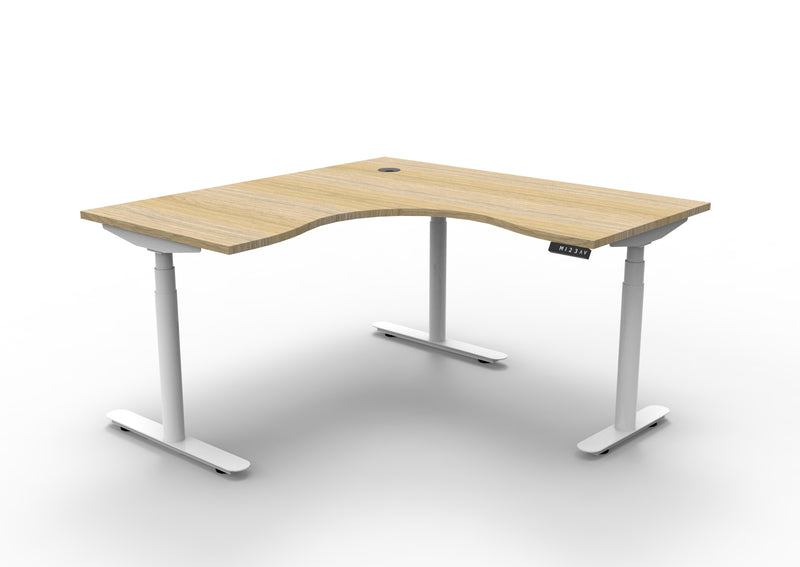 Rapidline Halo Plus electric height adjustable corner workstation on 70mm diameter round columns, E0 rated Natural Oak top with a white satin powdercoated frame. Supplied product image for model H+CNR1P1515 NO/WS.