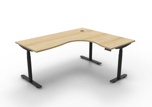 Rapidline Halo Plus electric height adjustable corner workstation on 70mm diameter round columns, E0 rated Natural Oak top with a black satin powdercoated frame. Supplied product image for model H+CNR1P1815 NO/BL.