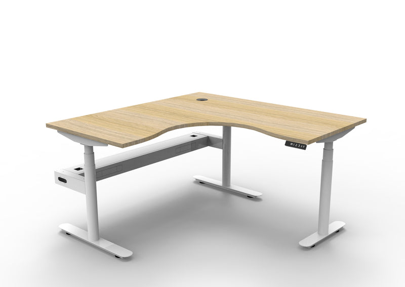 Rapidline Halo Plus electric height adjustable corner workstation on 70mm diameter round columns, E0 rated Natural Oak top with a white satin powdercoated frame, fitted ducted cable tray. Supplied product image for model H+CNRCT1P1515 NO/WS.