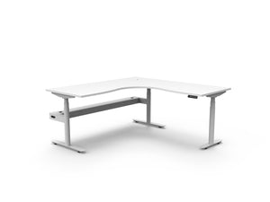 Rapidline Halo Plus electric height adjustable corner workstation on 70mm diameter round columns, E0 rated Natural White top with a white satin powdercoated frame, fitted ducted cable tray. Supplied product image for model H+CNRCT1P1818 NW/WS.