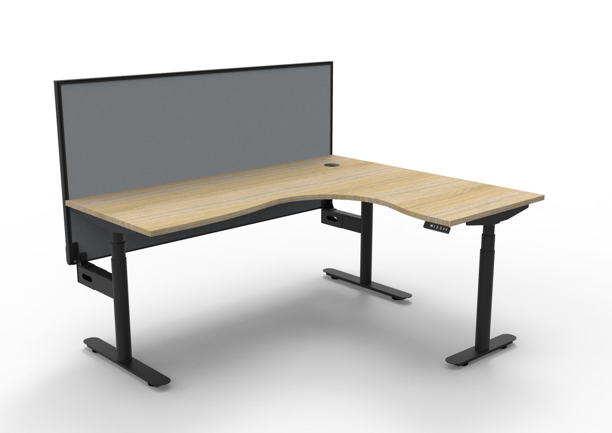 Rapidline Halo Plus electric height adjustable corner workstation on 70mm diameter round columns, E0 rated Natural Oak top with a black satin powdercoated frame, 900mm black fabric privacy screen. Supplied product image for model H+CNRWS1P1815 NO/BL.