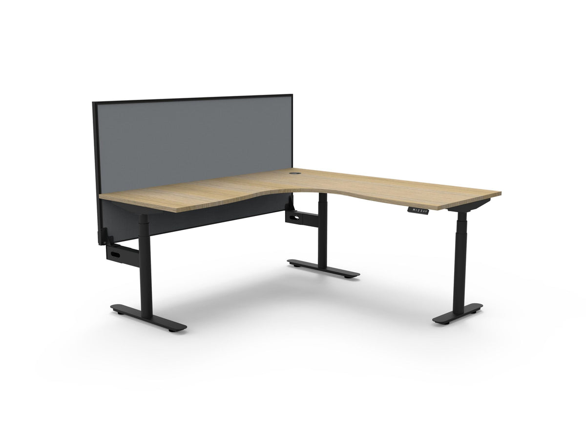 Rapidline Halo Plus electric height adjustable corner workstation on 70mm diameter round columns, E0 rated Natural Oak top with a black satin powdercoated frame, 900mm black fabric privacy screen. Supplied product image for model H+CNRWS1P1818 NO/BL.