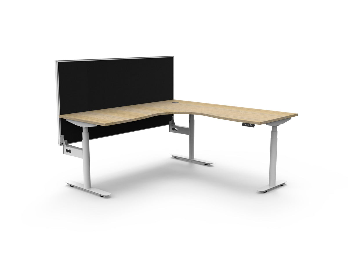 Rapidline Halo Plus electric height adjustable corner workstation on 70mm diameter round columns, E0 rated Natural Oak top with a white satin powdercoated frame, 900mm black fabric privacy screen. Supplied product image for model H+CNRWS1P1818 NO/WS.