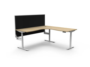 Rapidline Halo Plus electric height adjustable corner workstation on 70mm diameter round columns, E0 rated Natural Oak top with a white satin powdercoated frame, 900mm black fabric privacy screen. Supplied product image for model H+CNRWS1P1818 NO/WS.