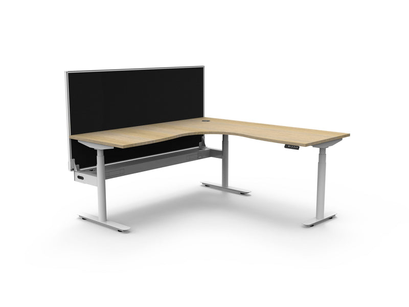Rapidline Halo Plus electric height adjustable corner workstation on 70mm diameter round columns, E0 rated Natural Oak top with a white satin powdercoated frame, fitted ducted cable tray, 900mm black fabric privacy screen. Supplied product image for model H+CNRWSCT1P1818 NO/WS.