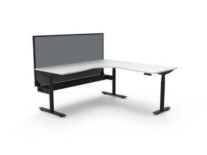 Rapidline Halo Plus electric height adjustable corner workstation on 70mm diameter round columns, E0 rated Natural White top with a black satin powdercoated frame, fitted ducted cable tray, 900mm black fabric privacy screen. Supplied product image for model H+CNRWSCT1P1818 NW/BL.