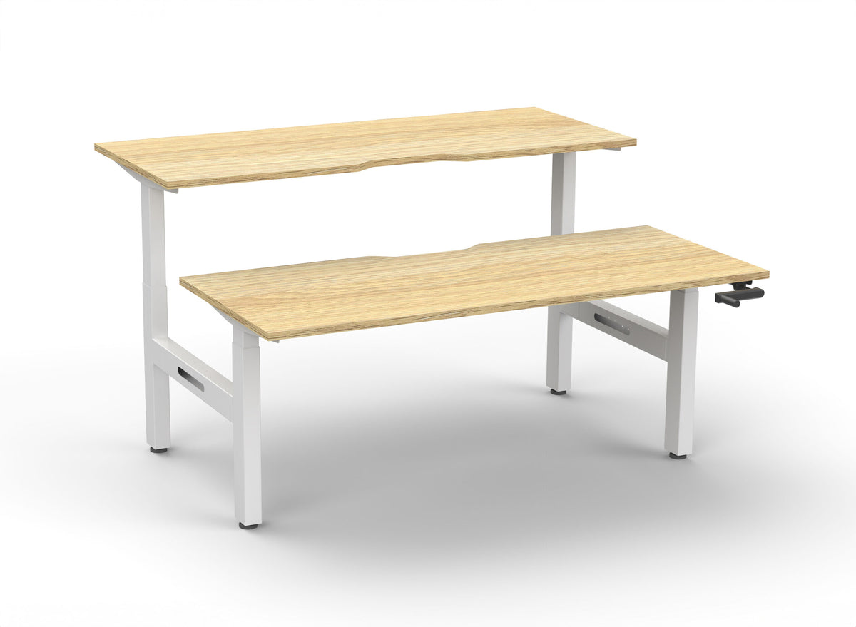 Rapidline Boost Crank manual height adjustable back to back workstation, E0 rated Natural Oak top on a white satin powdercoated frame. Supplied product image for model BC2P1875 NO/WS. View 1.