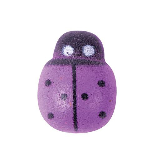Close-up of a purple Zart wooden ladybug with black spots