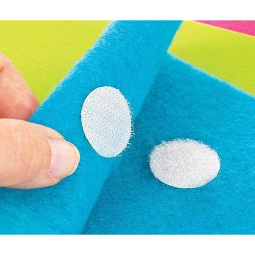 Hook fastener dot pressed onto blue felt